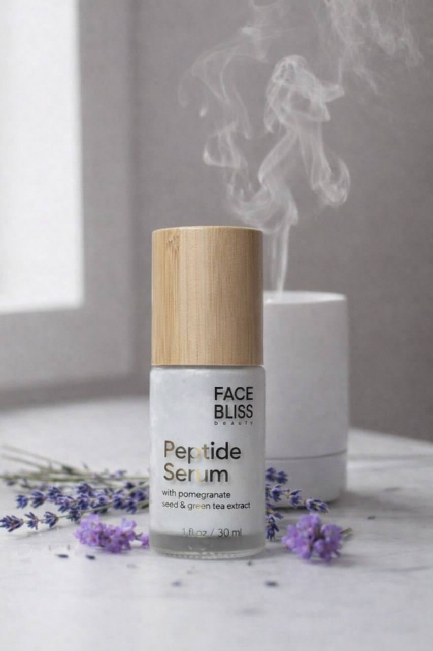 Face Bliss Peptide Serum bottle with wooden cap on a marble surface with lavender flowers and smoke effect.